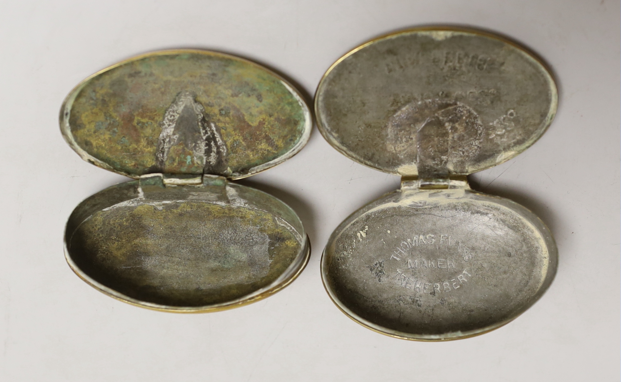 Two early 20th century brass miners’ snuff boxes, one with Welsh inscription